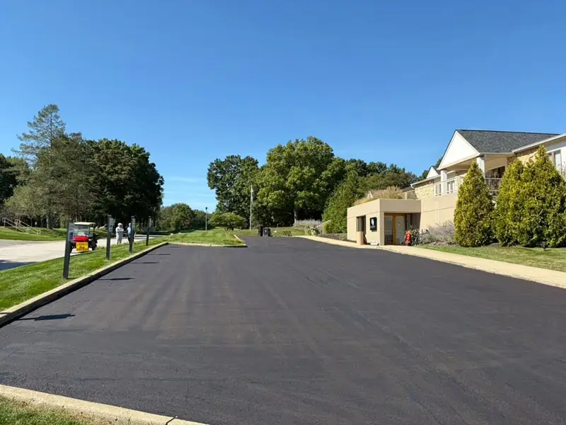 After: the same drive milled, leveled and re-capped with fresh asphalt